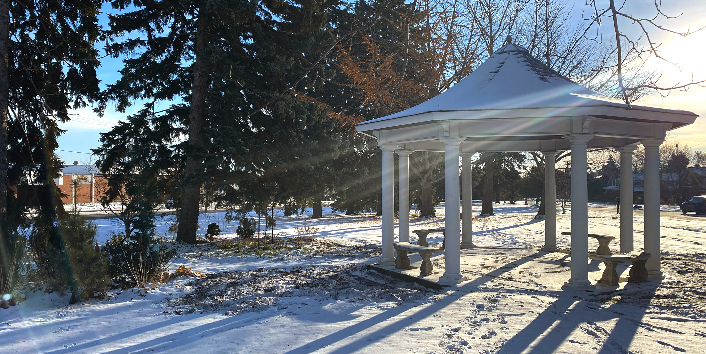 a gazebo in a snow covered field